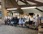 School choir performing for Warwick Court, Daventry customers