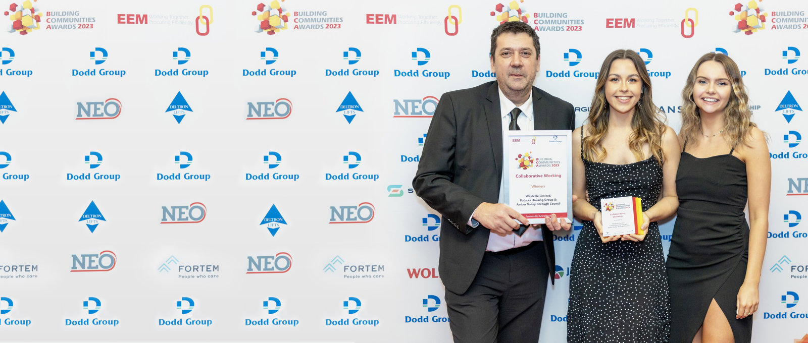 Photo of a Futures team member being presented with our Building Communities Award certificate